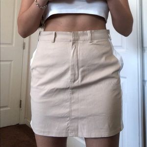 beige mini skirt